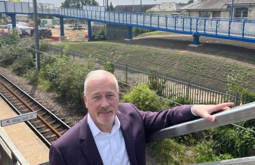 Richard Fuller MP at Biggleswade Railway station with new ramps in background