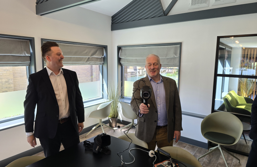 Richard Fuller MP holding the SOS Leak detection infra-red detection gun