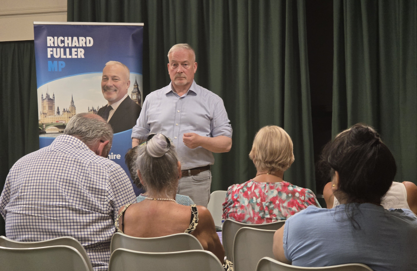 Richard addressing Roxton Town Hall meeting in July 2026