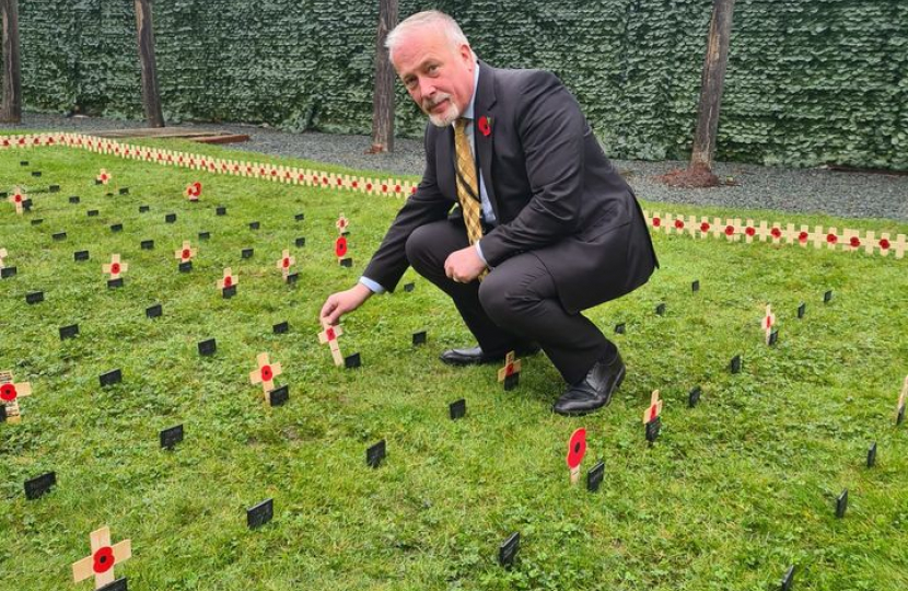 Richard 'planting' a Remembrance Stake in the parliamentary Garden of Remembrance