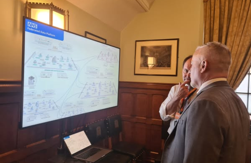 Richard Fuller MP being shown the Federated Data Platform in Parliament