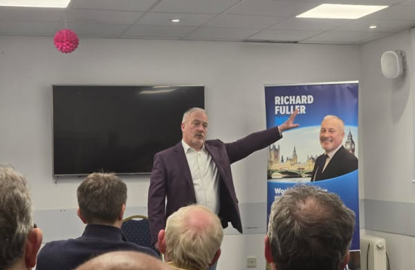 Richard addressing Great Denham town hall meeting in March 2025