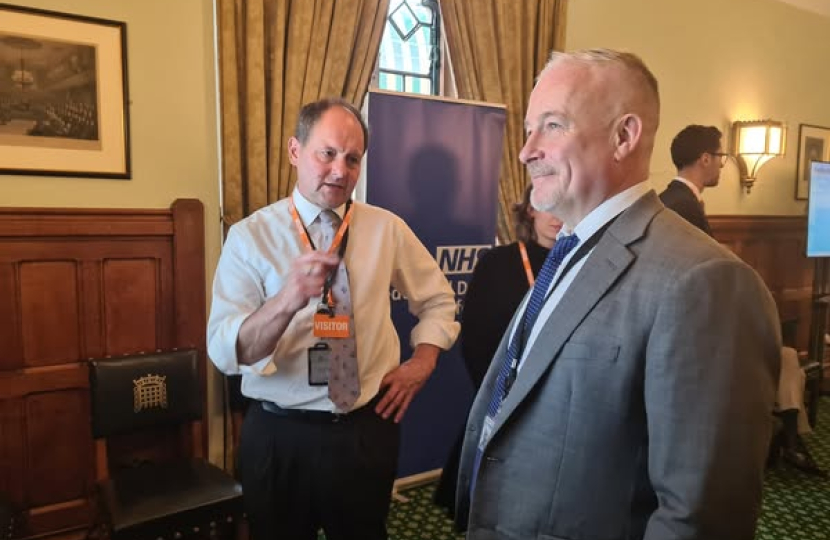 Richard Fuller MP being shown the Federated Data Platform in Parliament