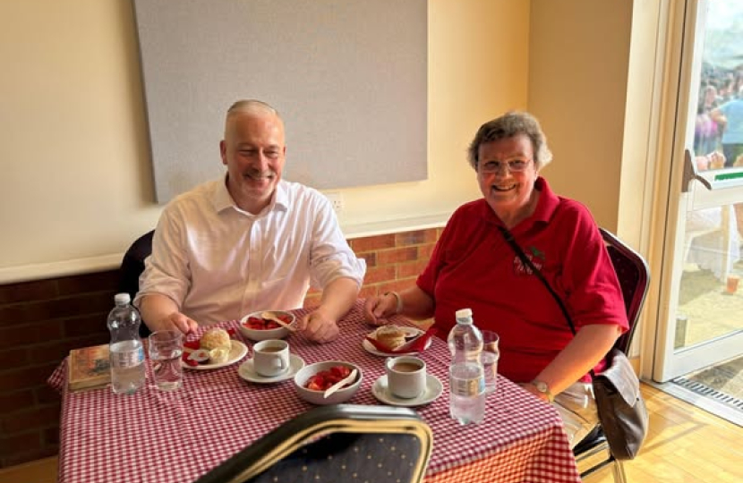 Richard Fuller MP enjoying a strawberry tea at the Yelden Strawberry Fayre
