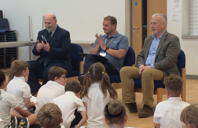 Headmaster Mr Leigh Pointon, Richard Fuller MP and Cllr Jim Weir listening to presentations from students at Riseley and Wilden Primary Schools