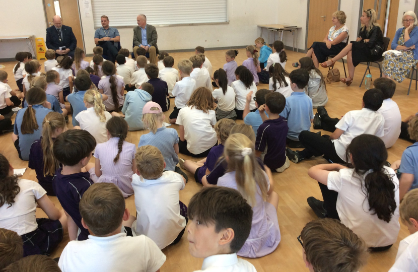 Headmaster Mr Leigh Pointon, Richard Fuller MP and Cllr Jim Weir listening to presentations from students at Riseley and Wilden Primary Schools