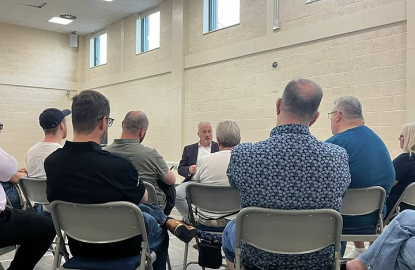 Photo of Richard speaking to residents at King's Reach Town Hall in Biggleswade July 2025