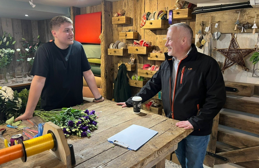 Richard Fuller MP talking to business owner on walkabout