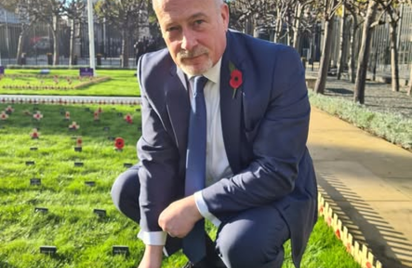 Richard Fuller planting Remembrance Stake