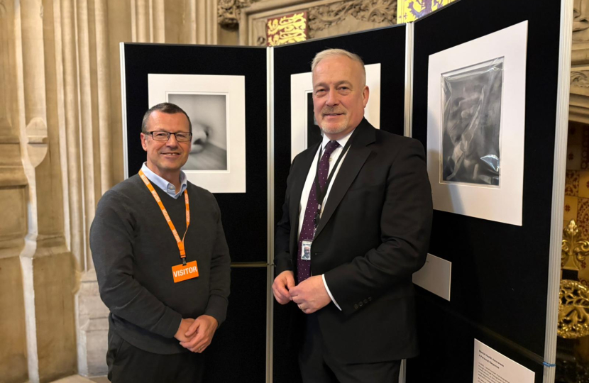 Richard Fuller MP with constituent Jonathan Vaines at a photo exhibition in Parliament