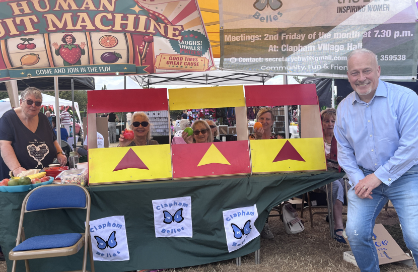 Richard Fuller MP playing the human fruit machine run by the Clapham Belles WI