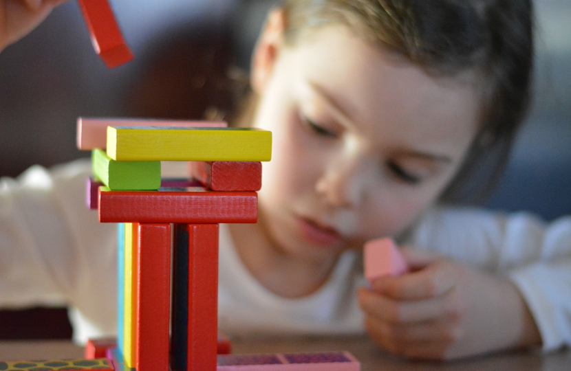 Image of a girl playing nursery games