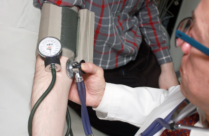 image of doctor taking blood pressure