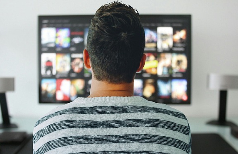 Image of a man watching television