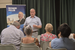 Richard addressing Roxton Town Hall meeting in July 2026