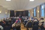 Richard addressing a town hall meeting in Sandy