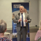 Richard addressing a town hall meeting