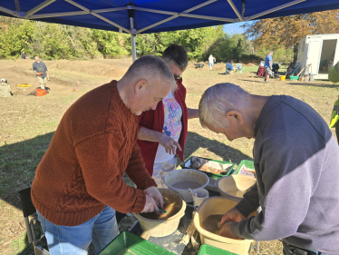 Richard cleaning pottery at the dig project on Manton Lane Bedford