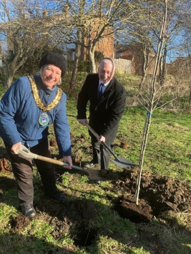 Richard planting an oak with Madeline Russell at The Spinney in Biggleswade.