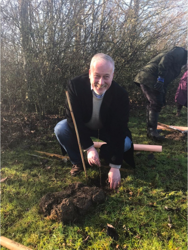 RF planting silver birch at Leslie Sell Centre