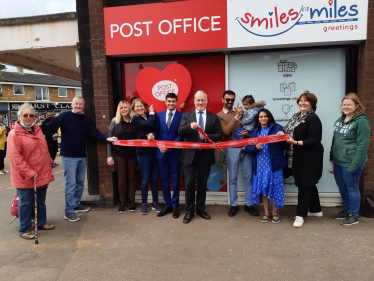 Richard cutting ribbon at Sandy Post Office