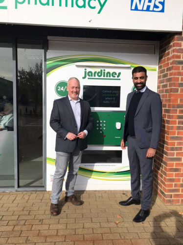 Richard at Jardines Biggleswade opening the new 24/7 prescription collection dispenser