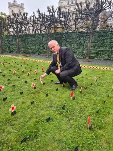 Richard 'planting' a Remembrance Stake in the parliamentary Garden of Remembrance