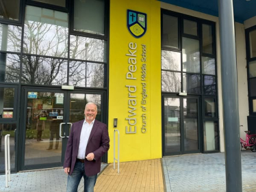 Richard Fuller MP outside Edward Peake School