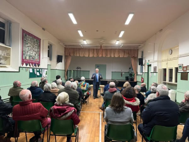 Richard Fuller MP addressing Turvey town hall meeting 