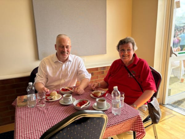 Richard Fuller MP enjoying a strawberry tea at the Yelden Strawberry Fayre