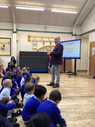 Richard speaking to the the students during assembly at St James' Primary