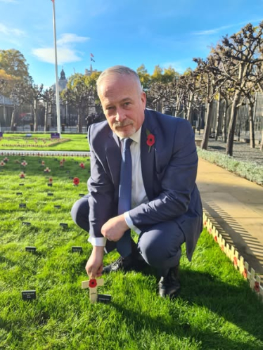 Richard Fuller planting Remembrance Stake