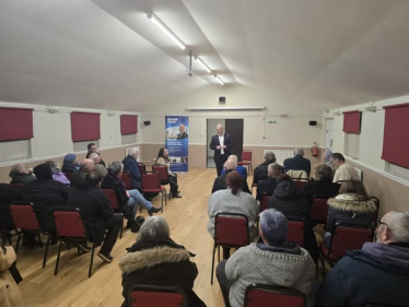 Richard Fuller MP addressing resident in Wyboston village hall