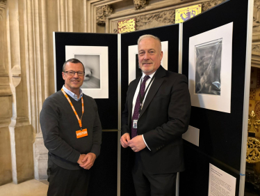 Richard Fuller MP with constituent Jonathan Vaines at a photo exhibition in Parliament