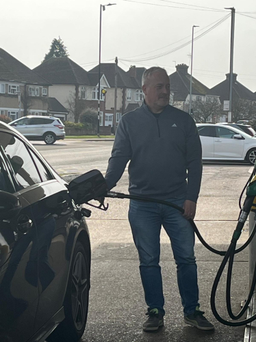 Richard filling his car with petrol and Bromham petrol station