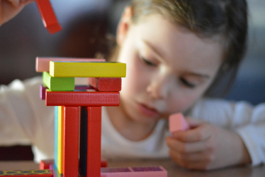 Image of a girl playing nursery games