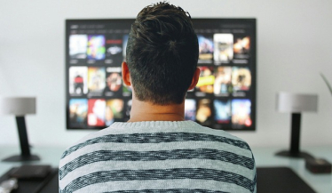 Image of a man watching television
